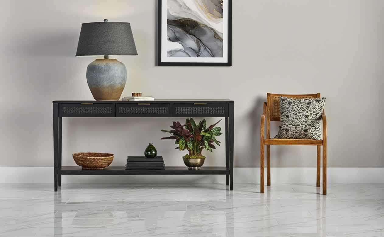 Grey marble tile floor with chair and side table. 