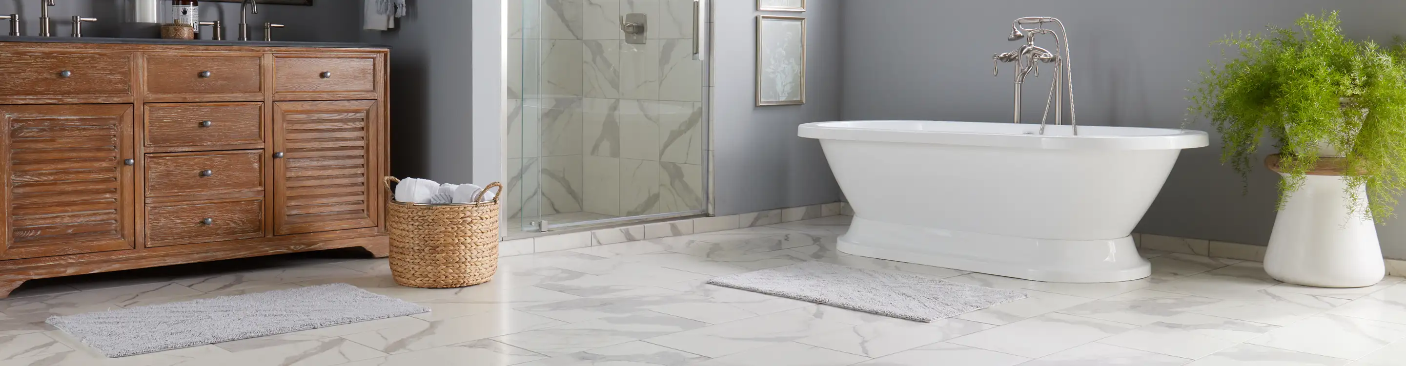 Tile in bathroom with standing tub 