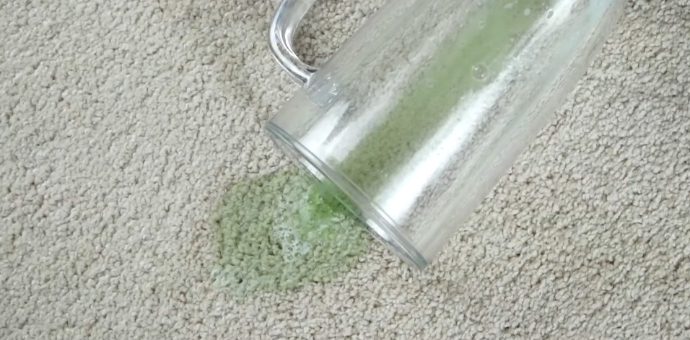 green beer spilled on carpet